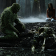 Swamp Thing and Abby Arcane staring at Alec Holland’s skeleton.